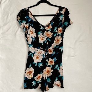 Floral Romper with small opening and tie in the front